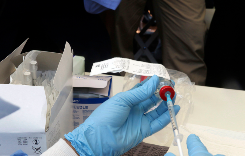 A health worker prepares an Ebola vaccine to administer to health workers during a vaccination campaign in Mbandaka, Congo.
